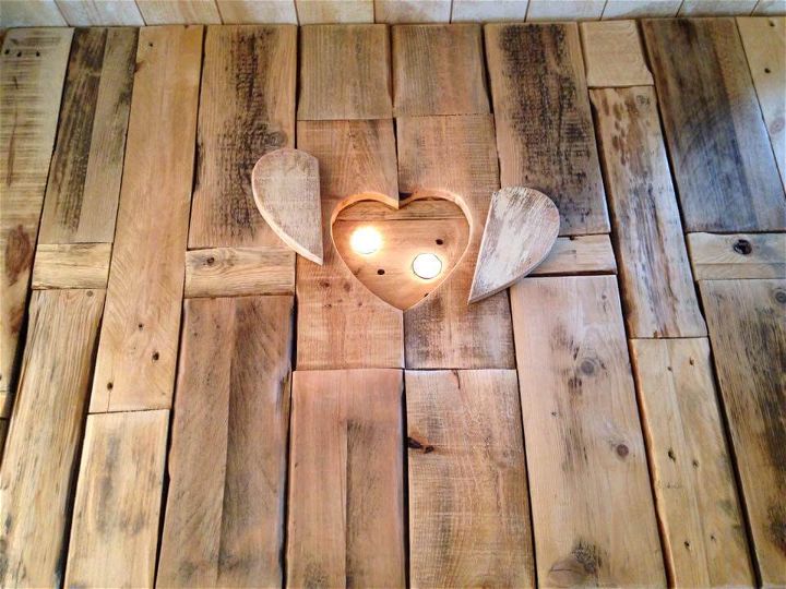 handcrafted pallet coffee table with wheels and heart shape candle inlay