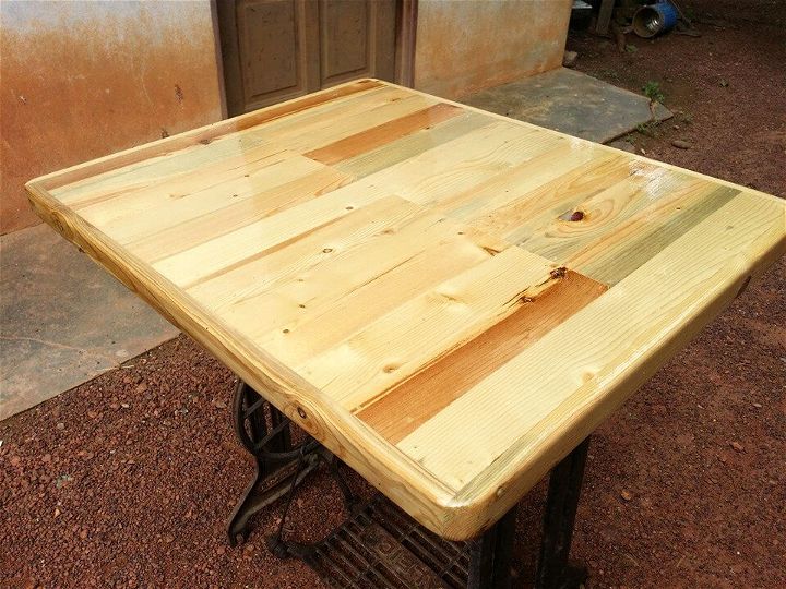 custom wooden pallet and old sewing machine base table
