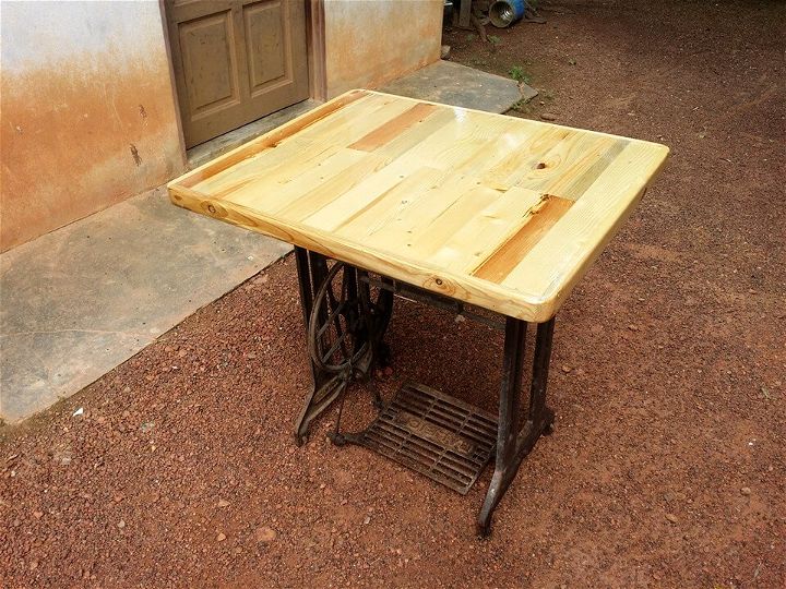 handcrafted pallet and old sewing machine base table