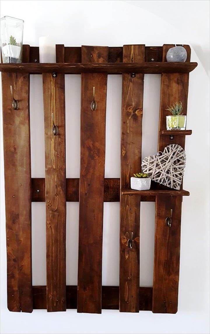wall organizer made from pallets with hooks and shelves